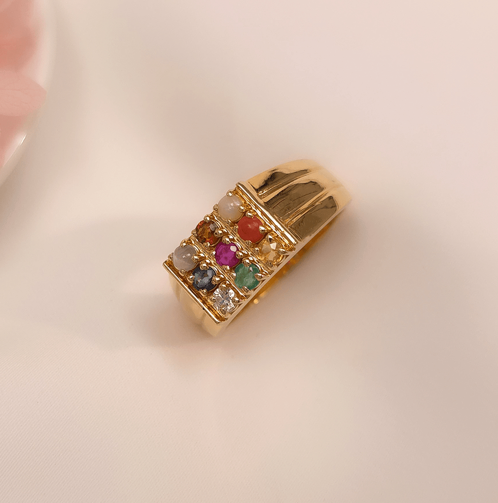 Buy Daario Men's Navratna Ring 18 KT yellow gold (8.6 gm). At Best Price In India. Check Rings New Designs At Giriraj Jewellers. BIS Care, Hallmark, 100% Certified | Trust & Quality of Giriraj Jewellers India | beautiful ring for men | diamond ring engagement men | diamond ring set for wedding | couple diamond ring | elegant men diamond ring | bold diamond men ring | men wedding diamond ring | mens diamond ring bands | real diamond ring for men | shop for diamond ring