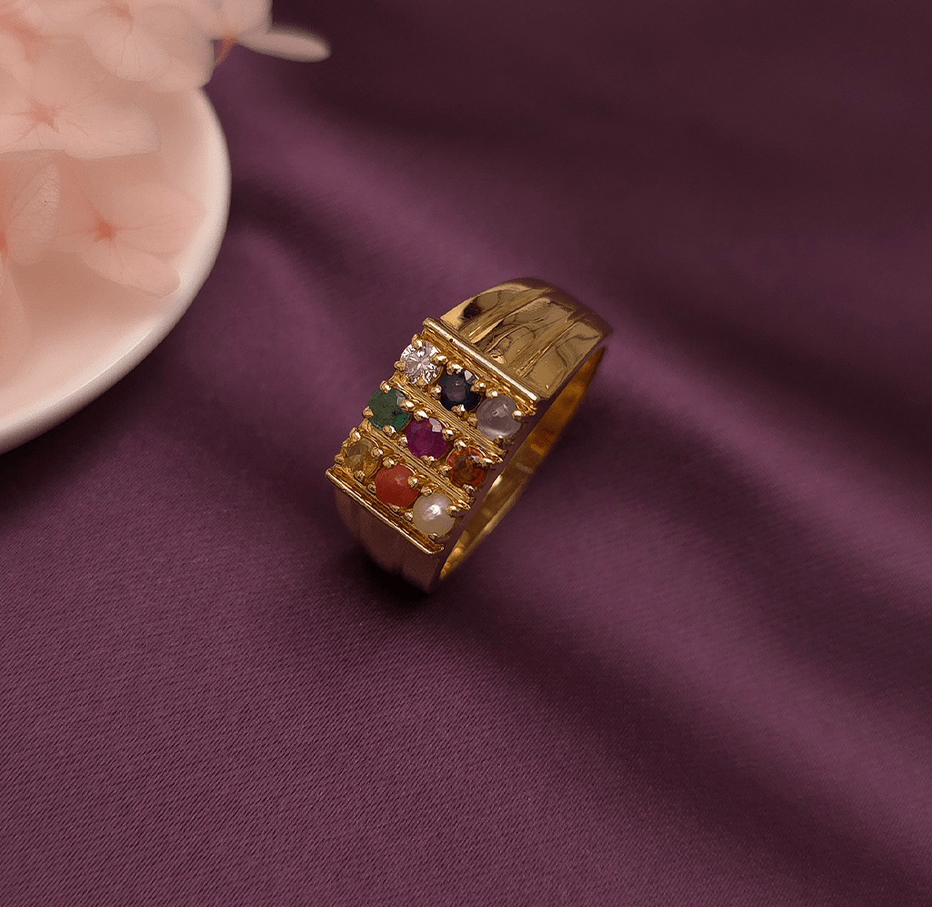 Buy Daario Men's Navratna Ring 18 KT yellow gold (8.6 gm). At Best Price In India. Check Rings New Designs At Giriraj Jewellers. BIS Care, Hallmark, 100% Certified | Trust & Quality of Giriraj Jewellers India | beautiful ring for men | diamond ring engagement men | diamond ring set for wedding | couple diamond ring | elegant men diamond ring | bold diamond men ring | men wedding diamond ring | mens diamond ring bands | real diamond ring for men | shop for diamond ring