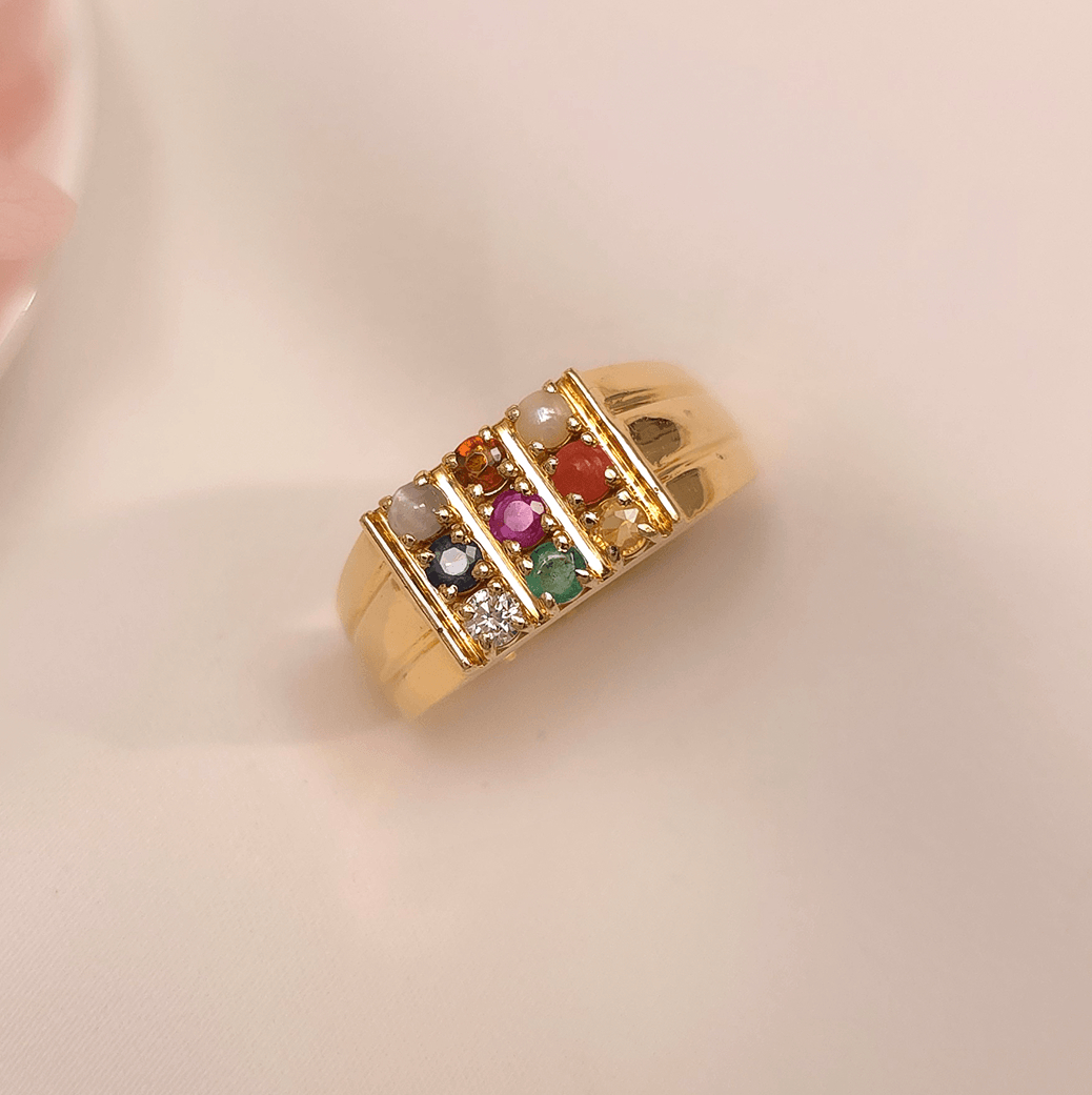Buy Daario Men's Navratna Ring 18 KT yellow gold (8.6 gm). At Best Price In India. Check Rings New Designs At Giriraj Jewellers. BIS Care, Hallmark, 100% Certified | Trust & Quality of Giriraj Jewellers India | beautiful ring for men | diamond ring engagement men | diamond ring set for wedding | couple diamond ring | elegant men diamond ring | bold diamond men ring | men wedding diamond ring | mens diamond ring bands | real diamond ring for men | shop for diamond ring
