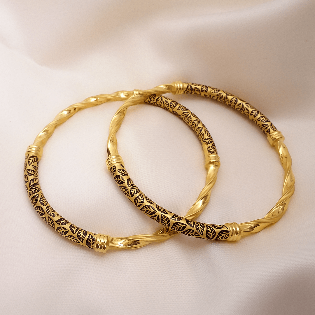 Buy Myra 22KT Twisted Gold Bangles 22 KT yellow gold (33.3 gm). At Best Price In India. Check Bangles & Bracelets New Designs At Giriraj Jewellers. BIS Care, Hallmark, 100% Certified | Trust & Quality of Giriraj Jewellers India | 24k gold bangles online | gold bangles for women new design | bracelet designs for wedding | buy gold diamond bangles | new gold bangles design | gold bracelet for mens with price | latest designs of gold bangles and kadas | trendy gold bangle for daily wear | gold bangles new design | gold kangan designs with price