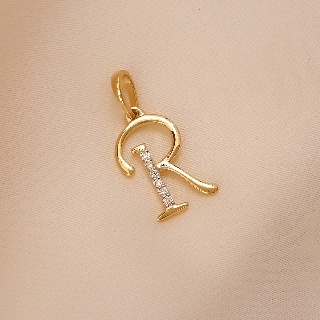 Buy R Rackish Diamond Letter Pendant 18 KT yellow gold (1.166 gm). At Best Price In India. Check Pendants New Designs At Giriraj Jewellers. BIS Care, Hallmark, 100% Certified | Trust & Quality of Giriraj Jewellers India | 