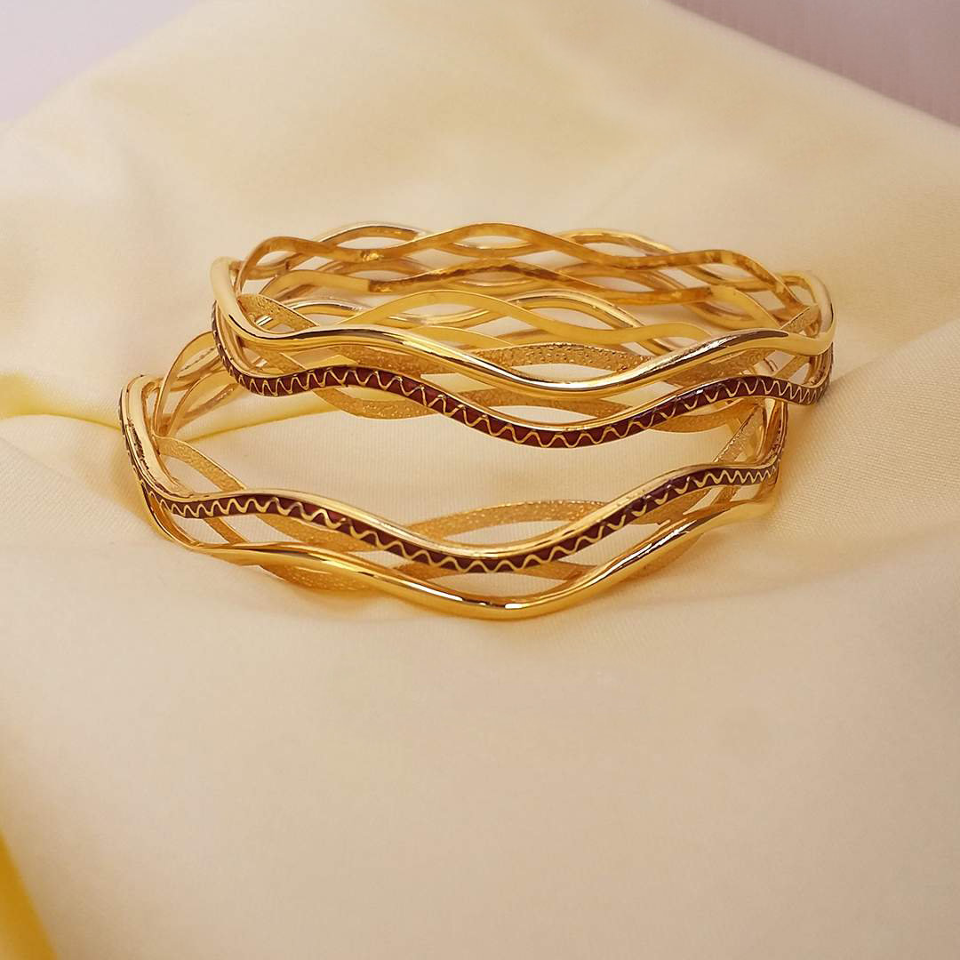Buy Nirvaan Twisted Gold Bangles 22 KT yellow gold (36.9 gm). | Online By Giriraj Jewellers