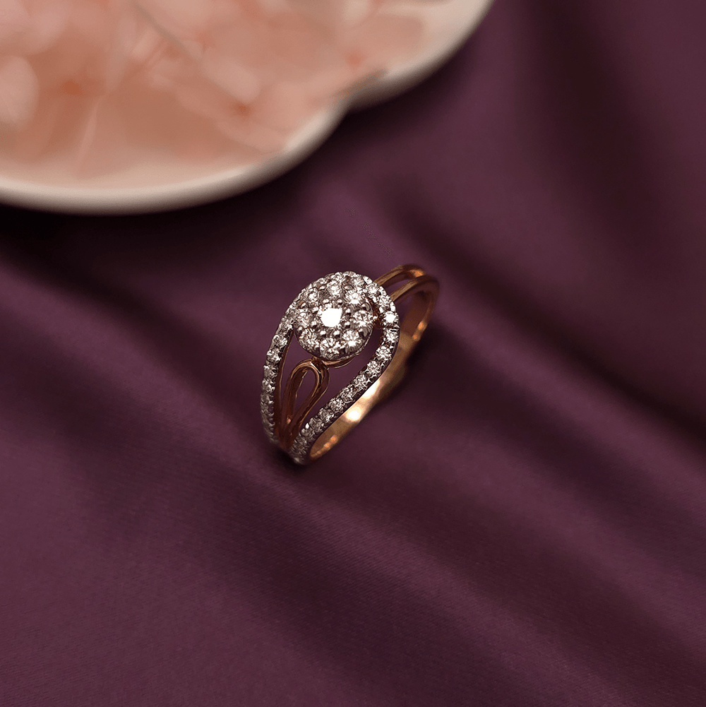 Buy Cori Rose Gold Diamond Ring 18 KT rose gold (3.37 gm). At Best Price In India. Check Rings New Designs At Giriraj Jewellers. BIS Care, Hallmark, 100% Certified | Trust & Quality of Giriraj Jewellers India | best diamond ring for engagement | Buy 18K Real Diamond Ring | buy diamond ring online | diamond ring designs | precious diamond wedding jewellery | trendy diamond rings for women | certified diamond ring collection | latest diamond jewellery designs | real diamond ring for women | solitaire designer jewellery