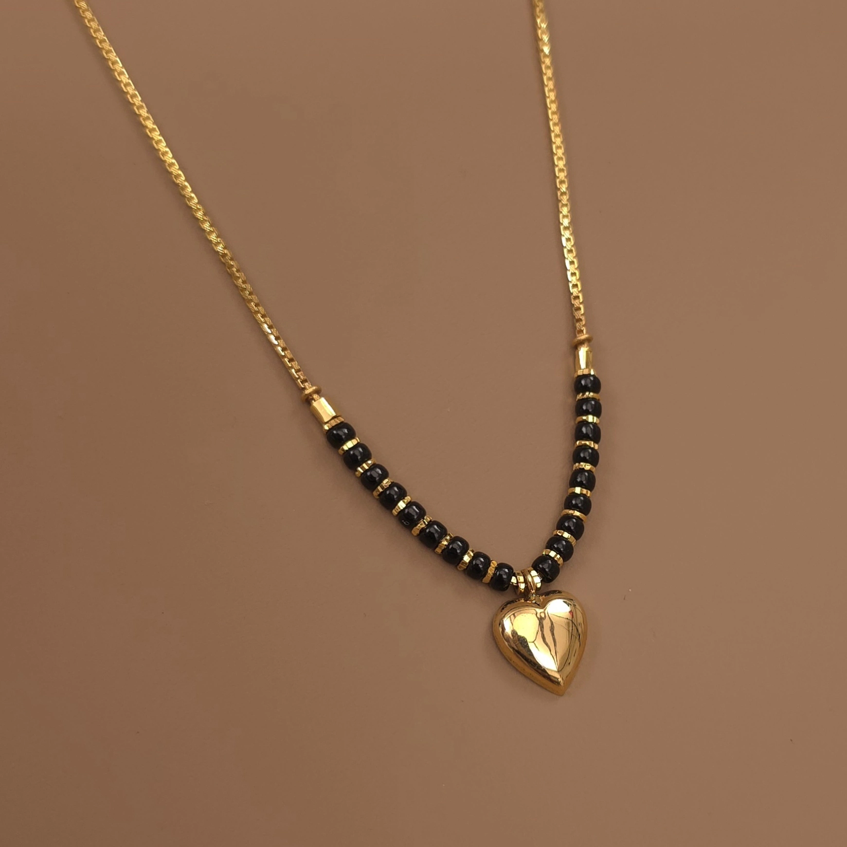 Buy Aponi Heart Gold Mangalsutra 22 KT yellow gold (6.99 gm). | Online By Giriraj Jewellers