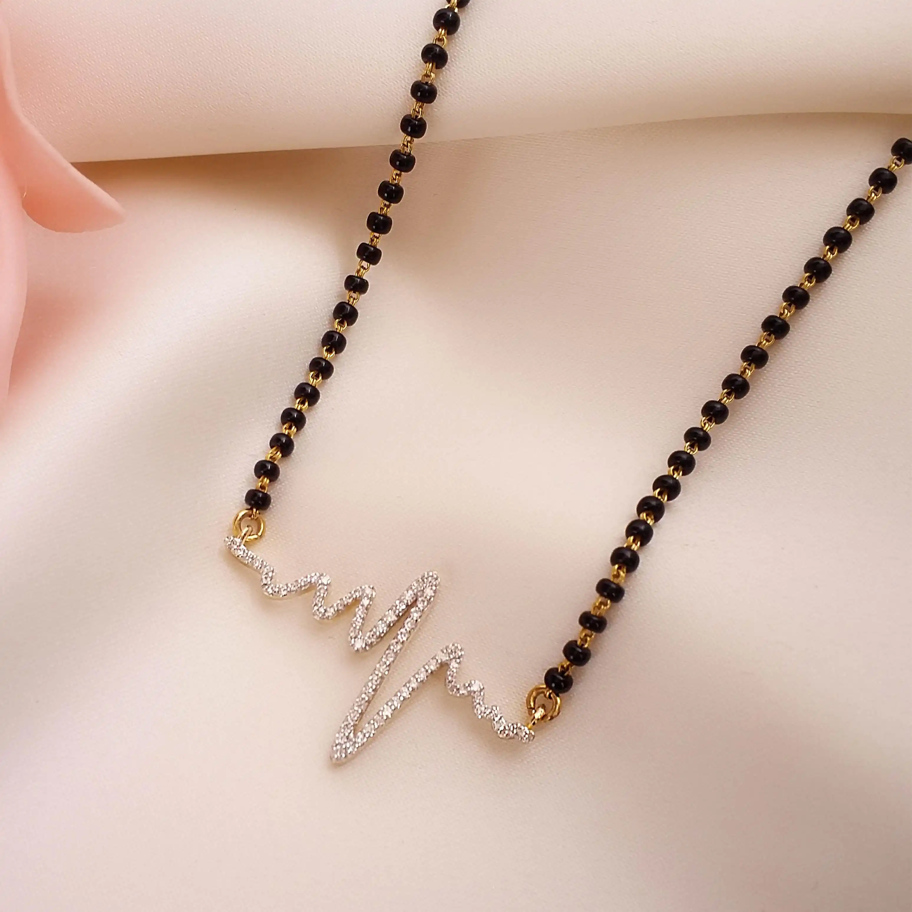 Buy Sasha Heartbeat Diamond Mangalsutra 18 KT yellow gold (4.92 gm). | Online By Giriraj Jewellers